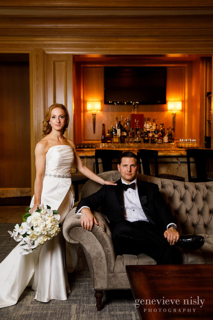Bride and groom pose for a portrait in the lobby of the Ritz Carlton Hotel in Cleveland.
