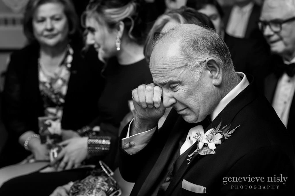 Dad wipes his eye during the wedding ceremony.