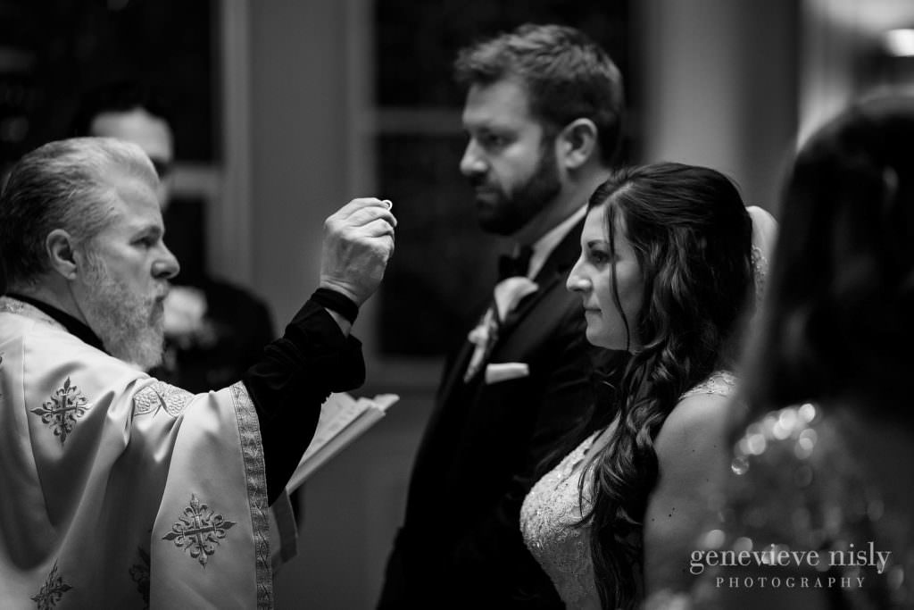 A ring blessing during the Greek wedding ceremony.