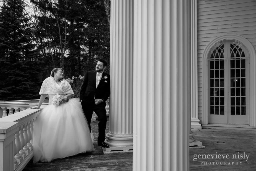 The bride and groom are posing for some portraits on their wedding day at Mooreland Mansion.