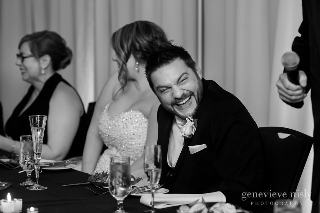 The groom laughs at the wedding toast given in his honor at the Cleveland Holiday Inn.