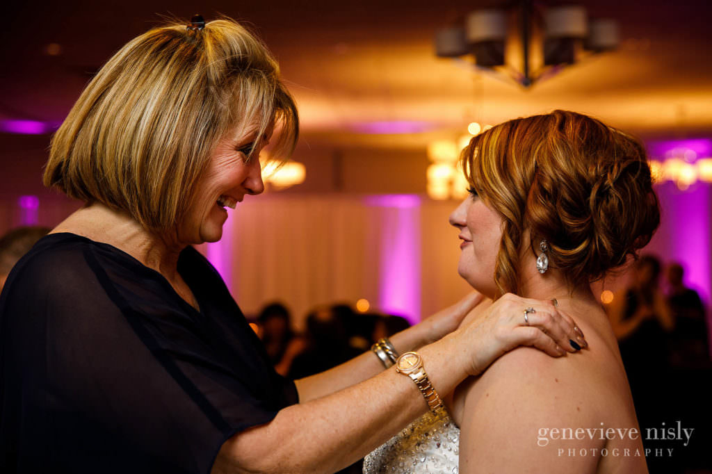 The bride enjoys a fun conversation with guests during her Cleveland wedding reception.