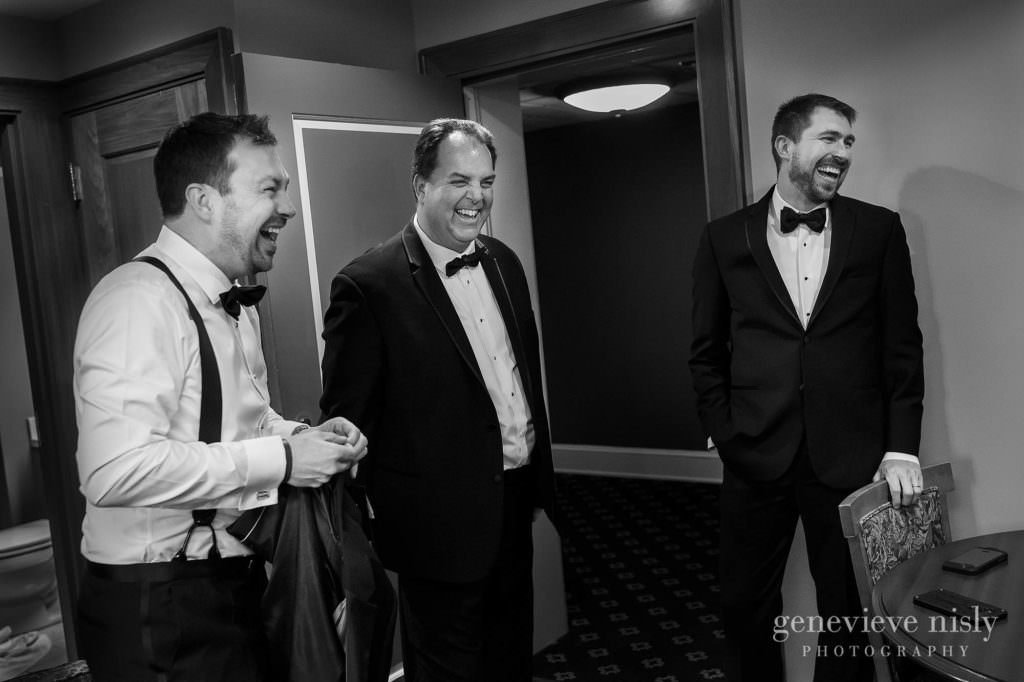 Groom and his groomsmen share a laugh.