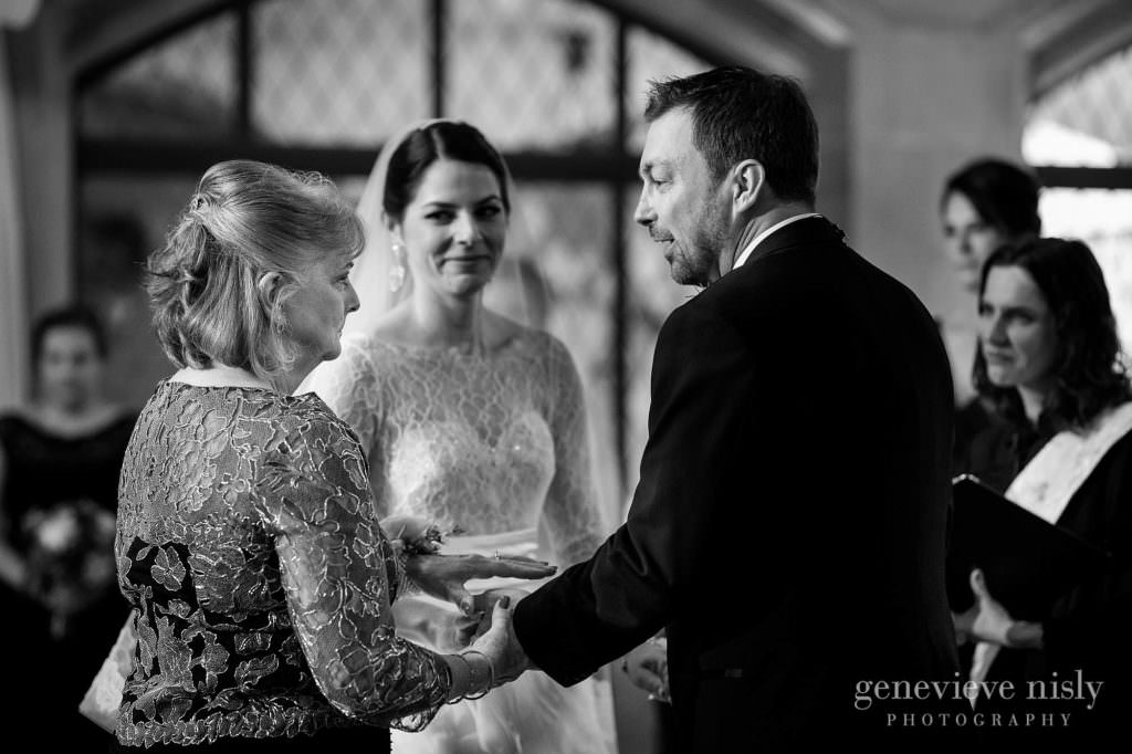 The groom greets the mother of the bride during the ceremony.