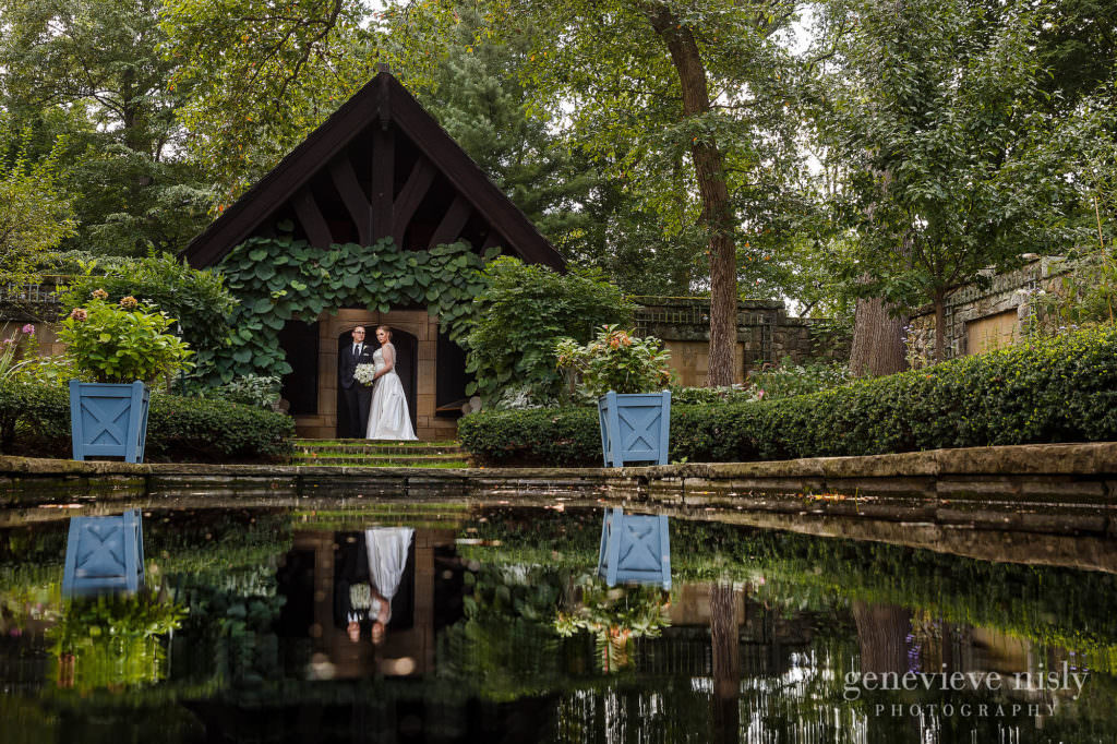 Bride and groom reflecting off the water in the English Garden during their wedding at Stan Hywet Hall and Gardens.