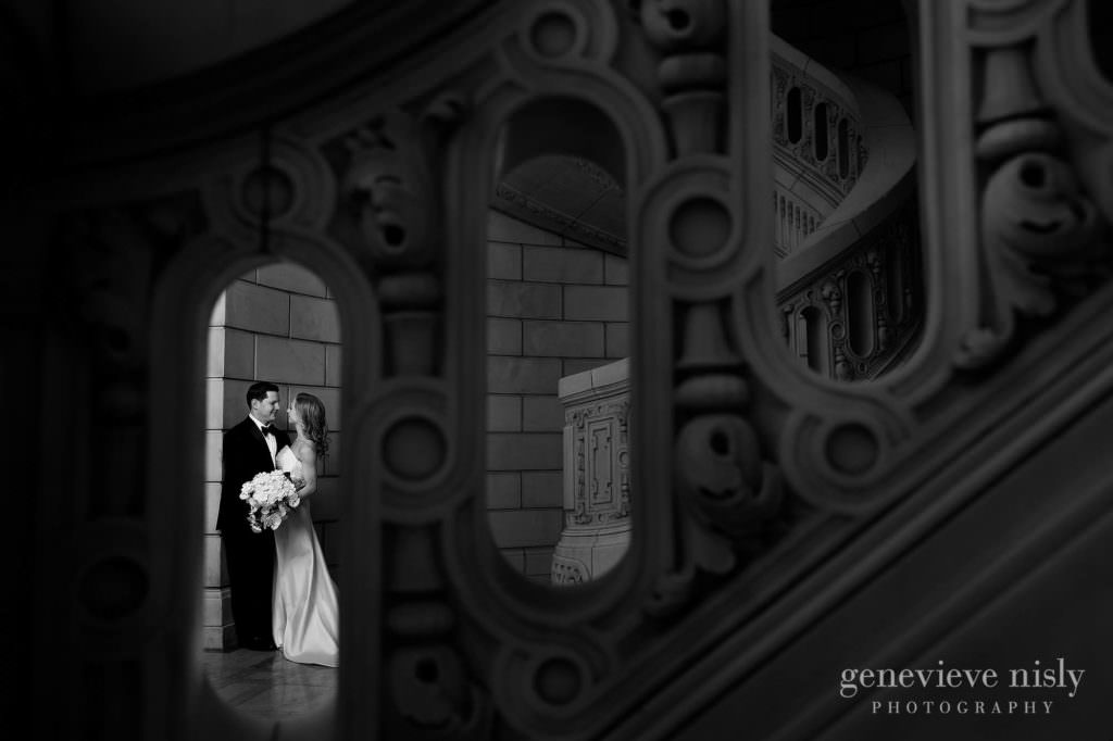 Black and white of the bride and groom in the Old Courthouse staircase.