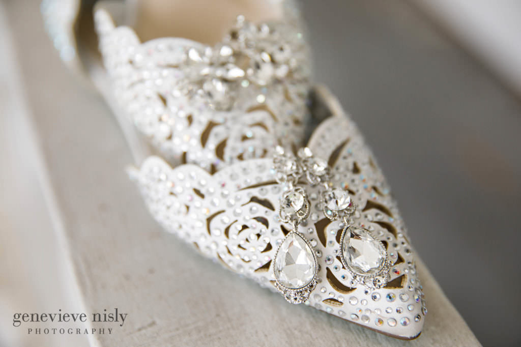 A bride's wedding shoes and earrings sparkle on the balcony at Mooreland Mansion in Kirkland.