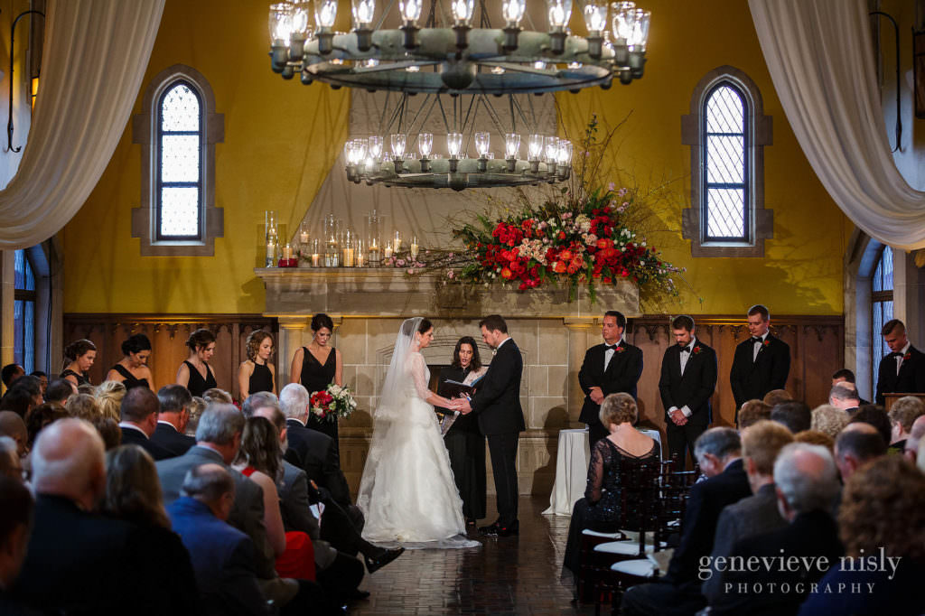 An overview of the wedding ceremony at Glenmoor Country Club with yellow walls.