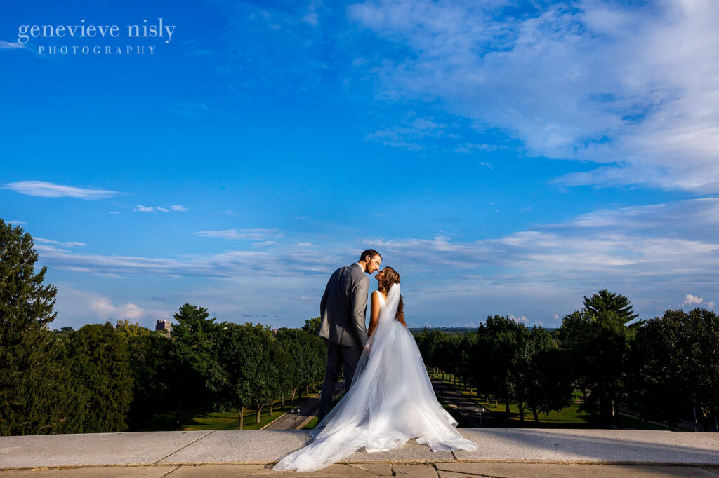 Kosta and Eleni share a moment in front of a blue sky during their wedding in North Canton, Ohio.