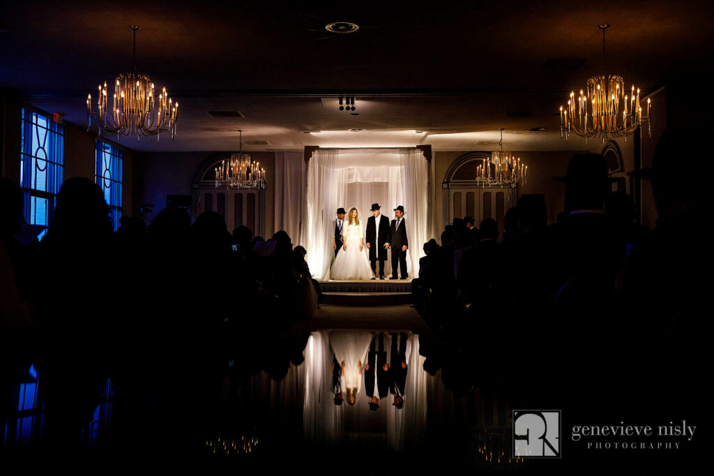 Nissan and Gila stand under the chuppah during their wedding ceremony in Cleveland, Ohio.
