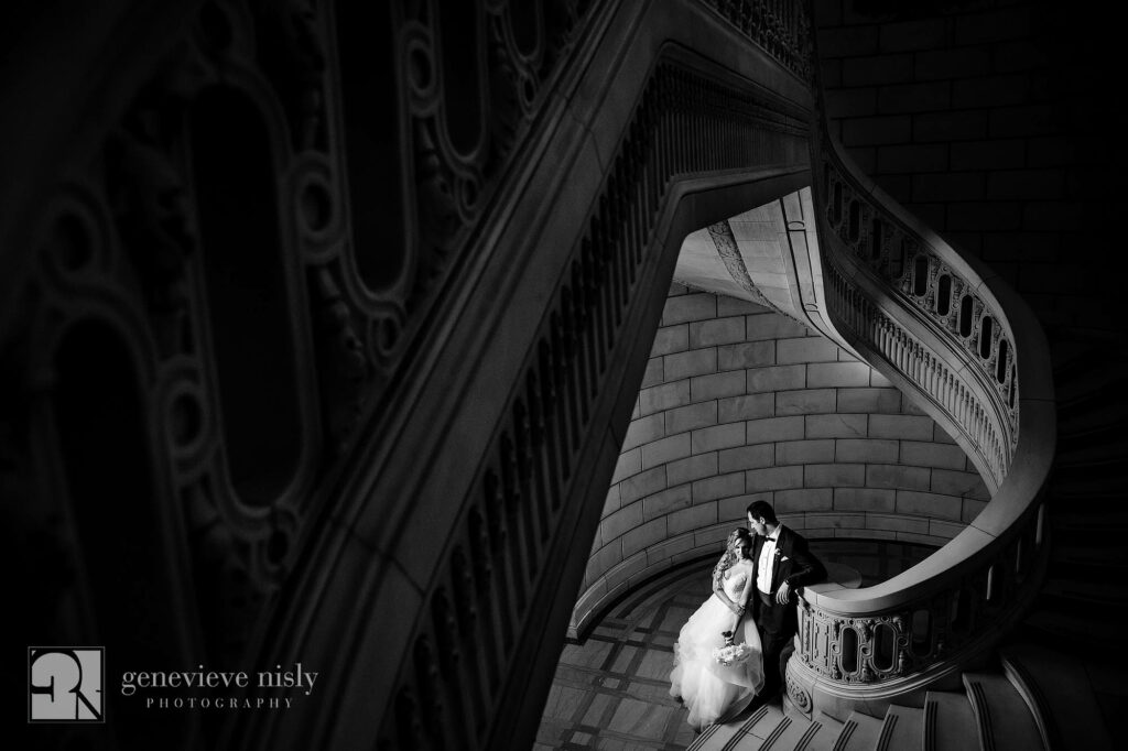 Navid and Melissa at the bottom fo the grand staircase during their Persian wedding at the Old Courthouse in Cleveland, Ohio.