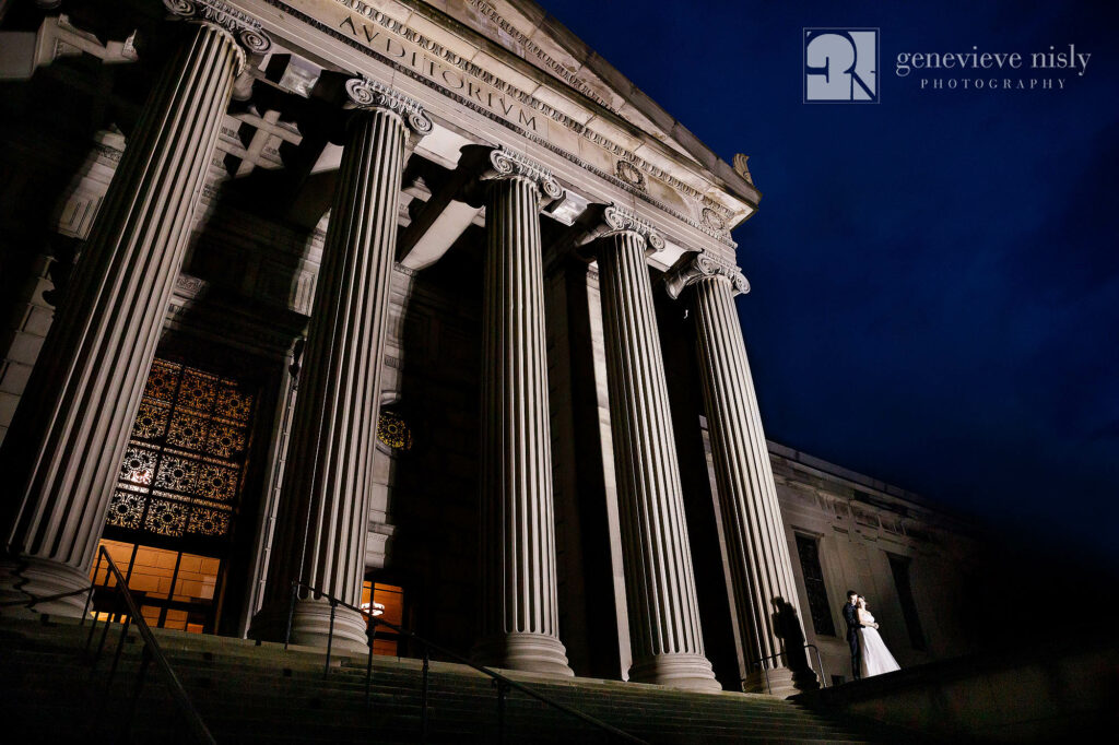 Matt and Brittany outside of Stambaugh Auditorium at night on their wedding day.