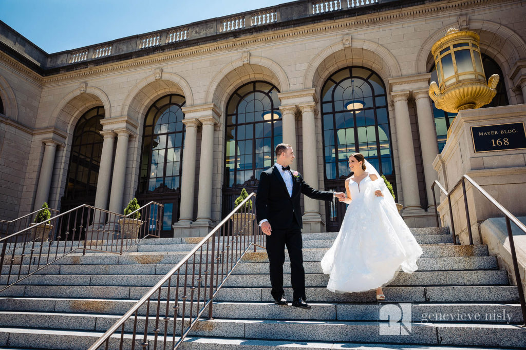 Ali and Jason walk down the post office steps in Downtown Akron on their wedding day.