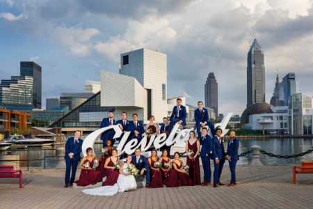 Wedding party at the Cleveland script sign at Voinovich Park.